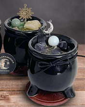 Load image into Gallery viewer, Cauldron candles for intention, color black made of ceramic dressed with herbs and crystals